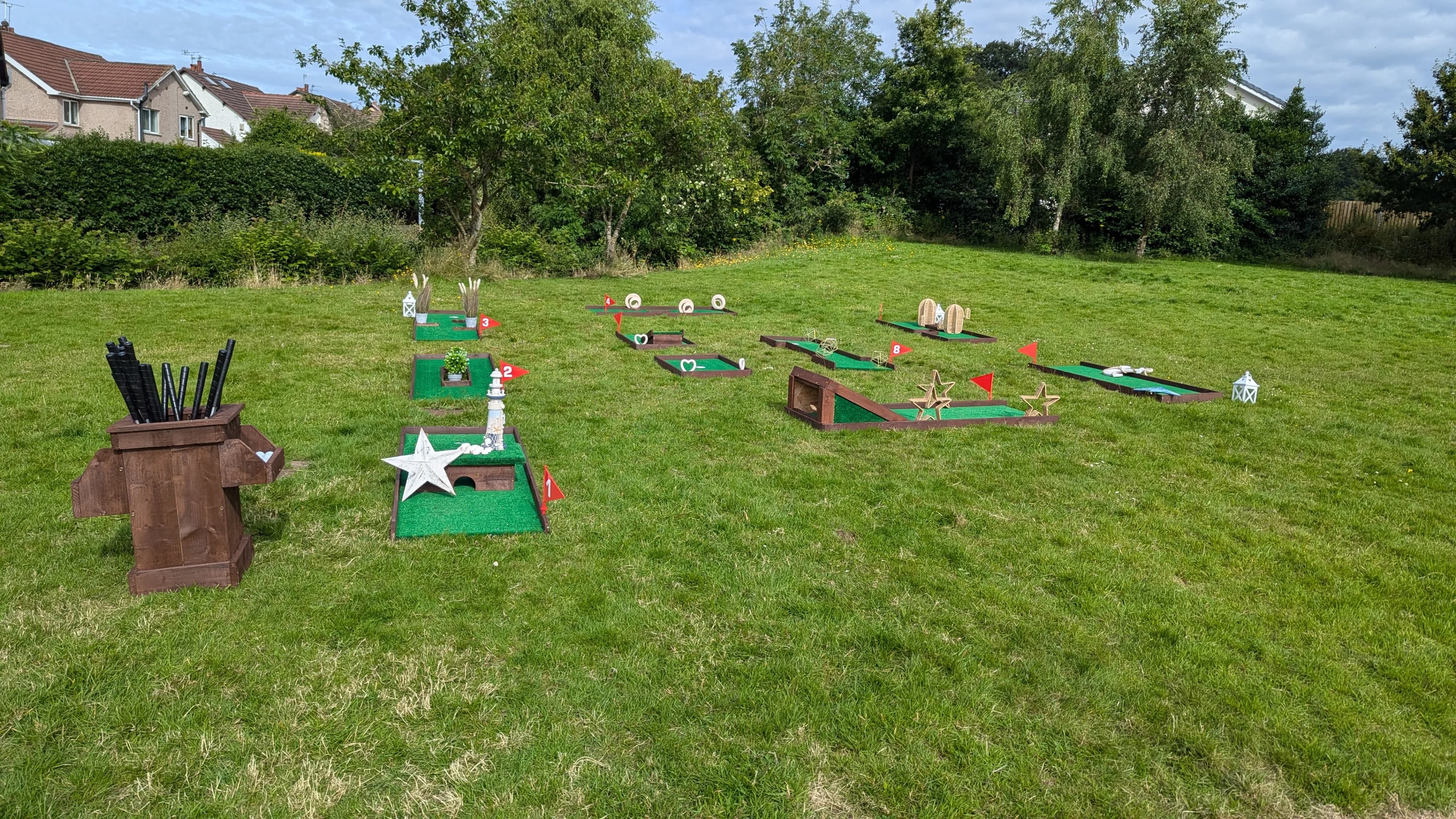 A Mini Golf Club 9-hole course set up on a wedding lawn